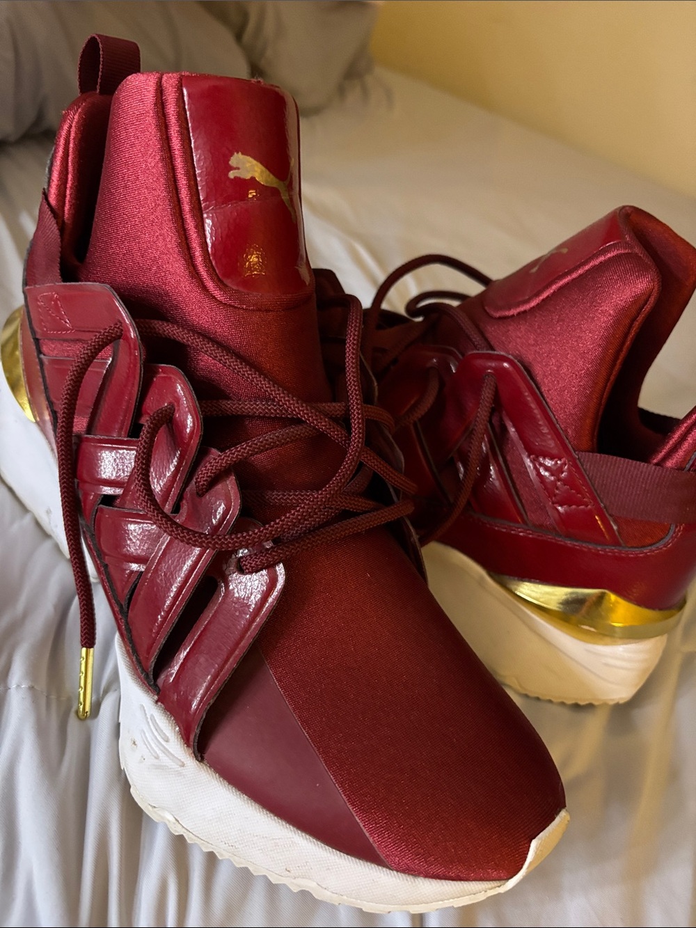Puma Women's Metallic Wine Red Sneakers with Gold Accent